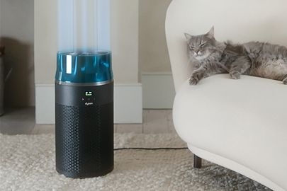 The Dyson HushJet Compact Purifier next to a kitchen island.