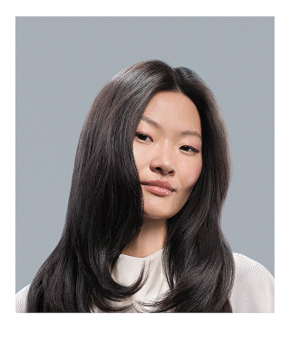Model with styled hair achieved using Dyson products and devices.