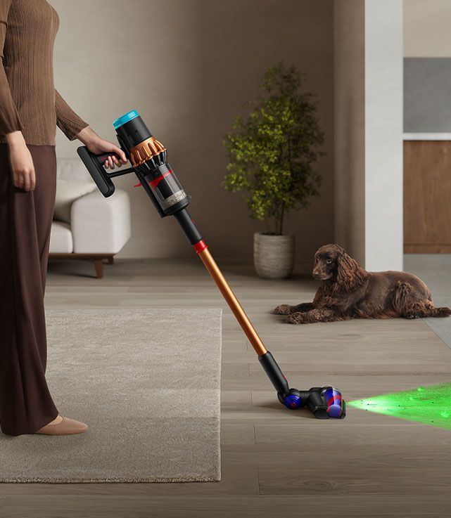 A person using the All Floor Cones Sense cleaner head with illumination.