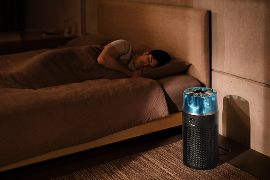 The Dyson HushJet Compact Purifier operates in a bedroom next to a sleeping person.