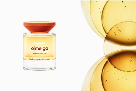 Dyson Omega hydrating hair oil next to a blend of oils.