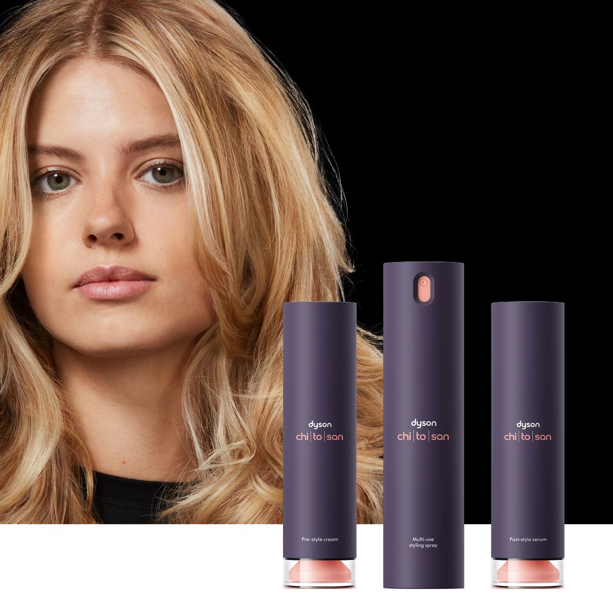 Model with styled hair behind the Dyson Chitosan styling range.