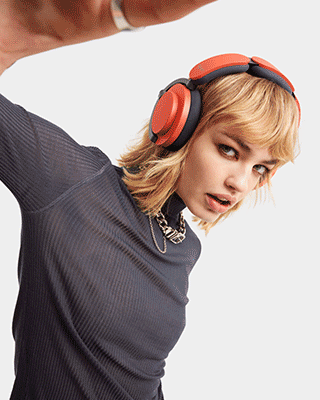 A model wearing Dyson OnTrac headphones.