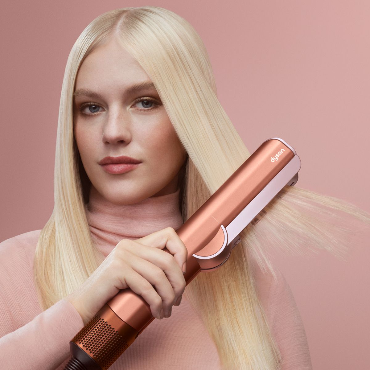 Picture of a model using Dyson Airstrait™ dryer and straightener