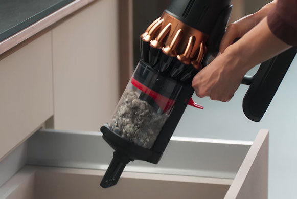 The Dyson V16 Piston Animal vacuum is hygienically wiped clean as it is emptied.