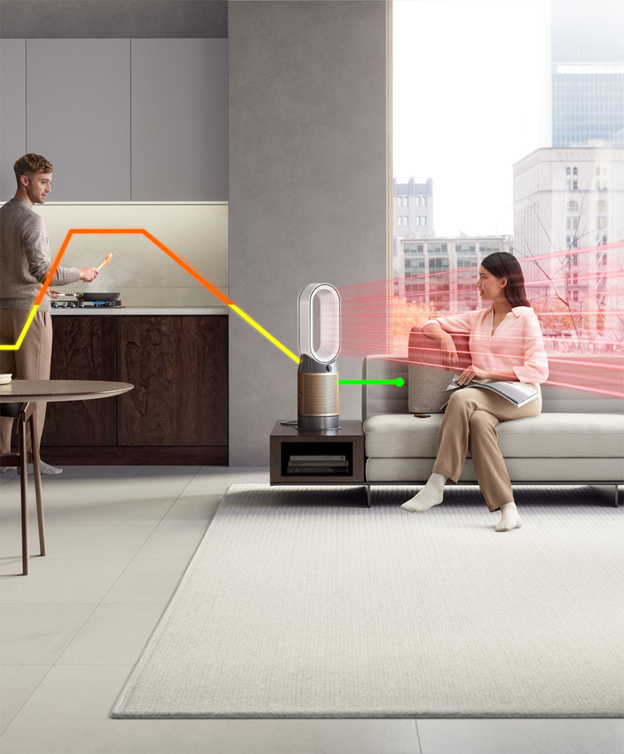 A man and woman relax at home with their Dyson purifier heater