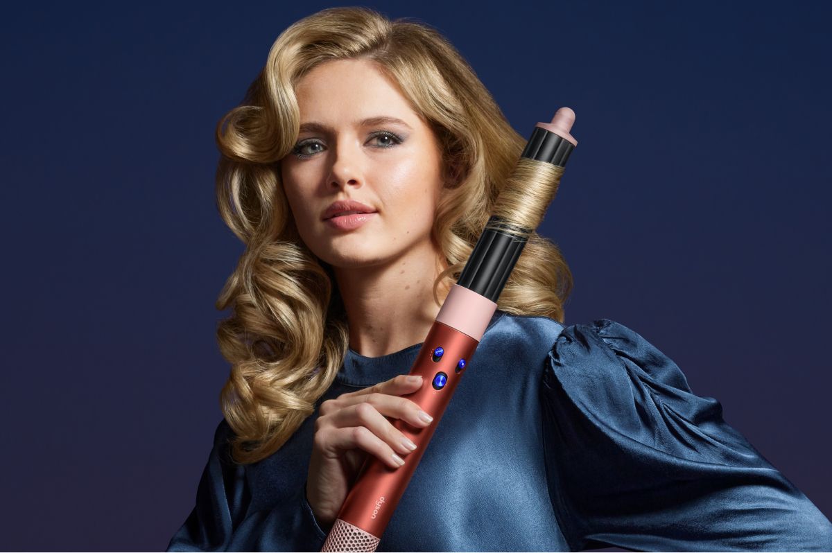 Model holding the Airwrap i.d. multi-styler and dryer